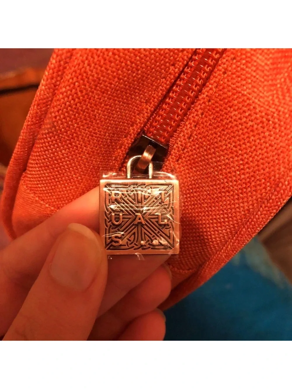 Brand new orange rituals make up bag